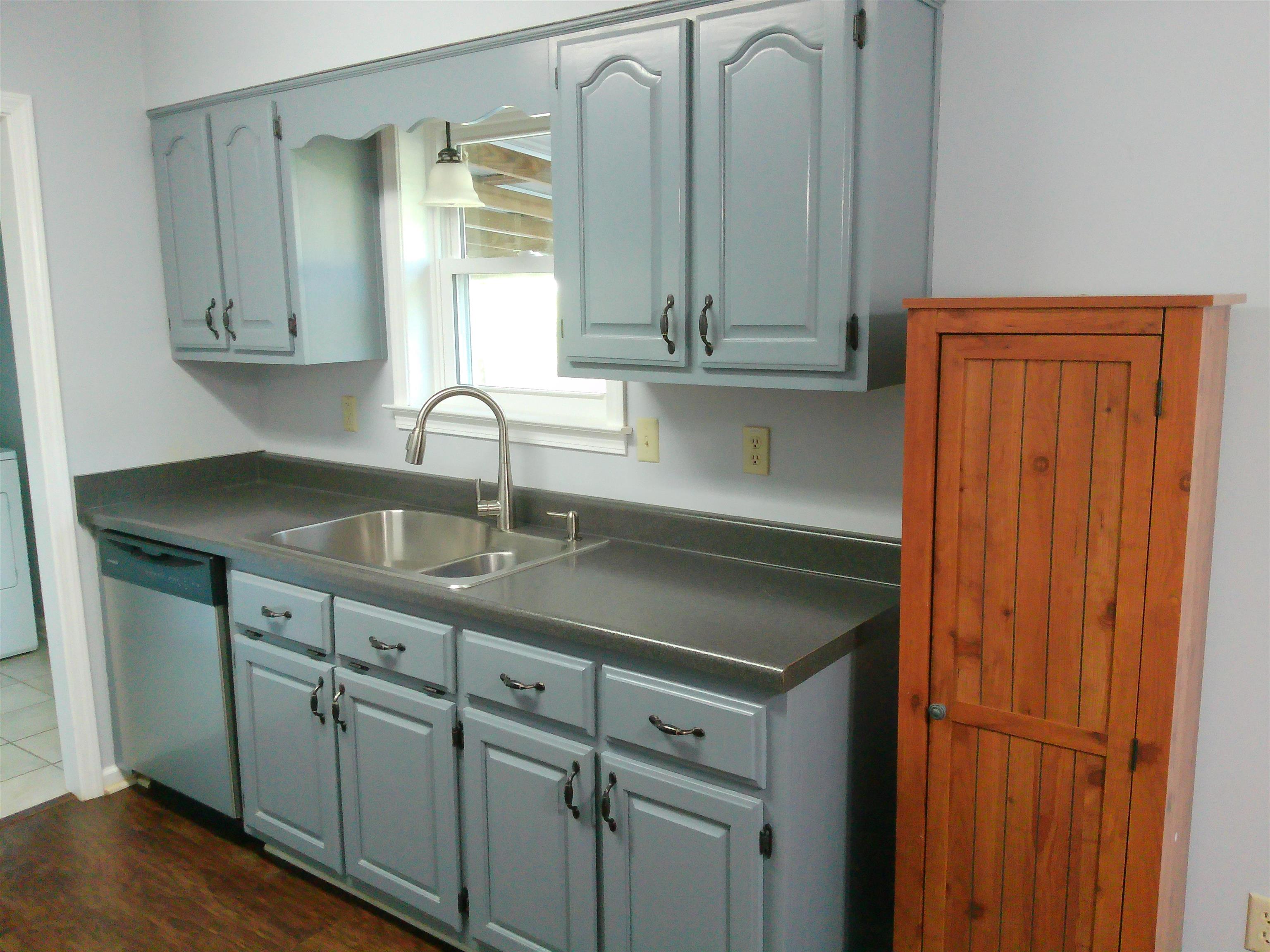 336 Pwr Loop Munford, TN 38058 - Photo 5 of 24 Kitchen featuring stainless steel dishwasher, gray cabinetry, and sink