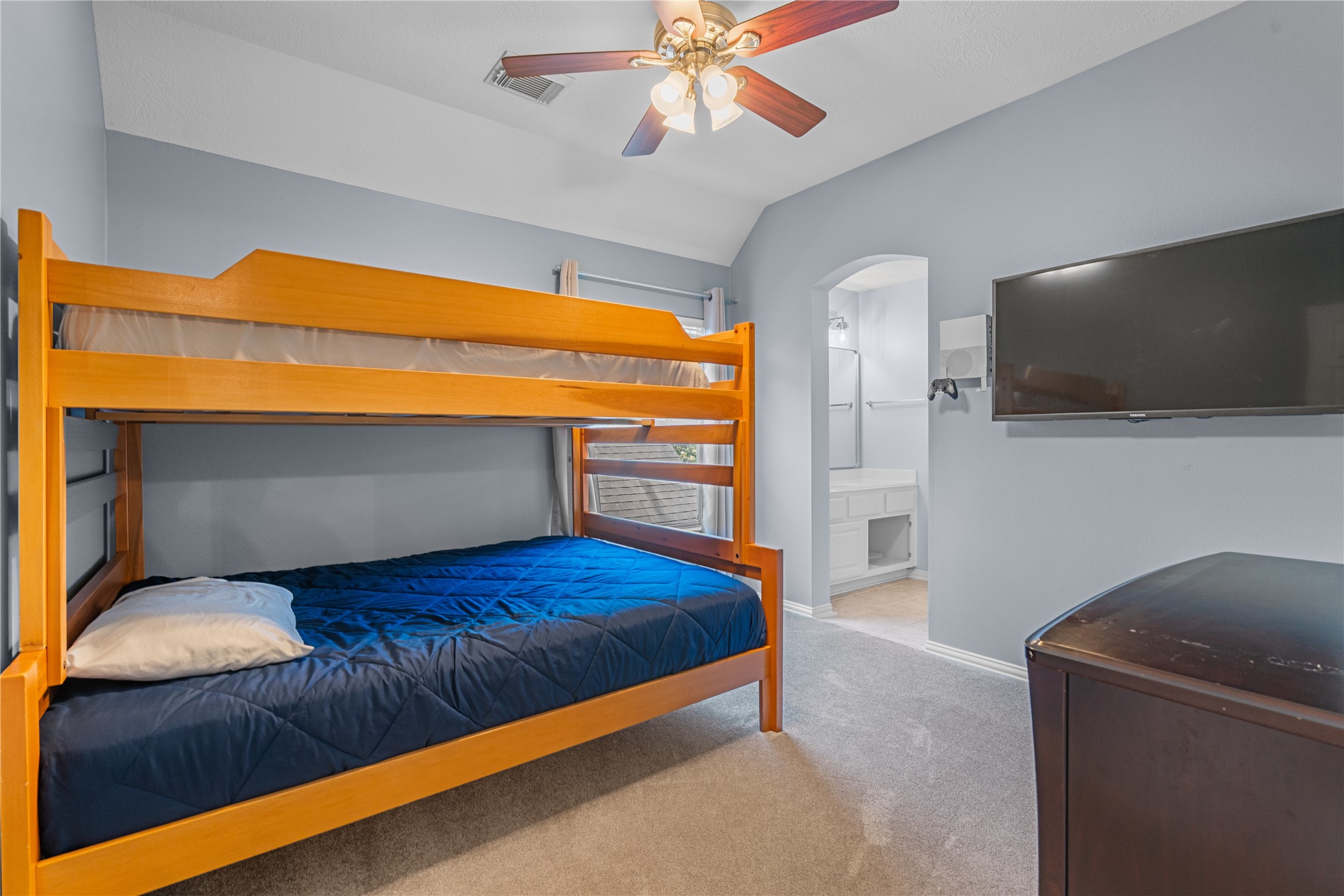 14718 Ramblebrook Humble, TX 77396 - Photo 21 of 38 A secondary bedroom with direct access to a shared ensuite, creating a practical and private connection between two upstairs bedrooms.