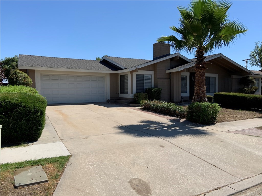 623 East Victoria Street Rialto, CA 92376 - Photo 1 of 1 a view of a house with a yard and potted plants