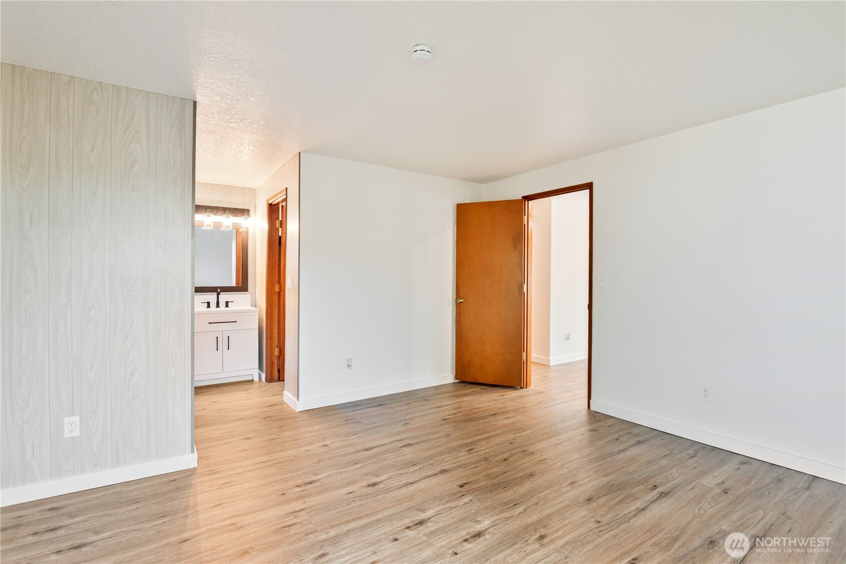 2421 Hickory Avenue Longview, WA 98632 - Photo 13 of 26 an empty room with wooden floor and windows