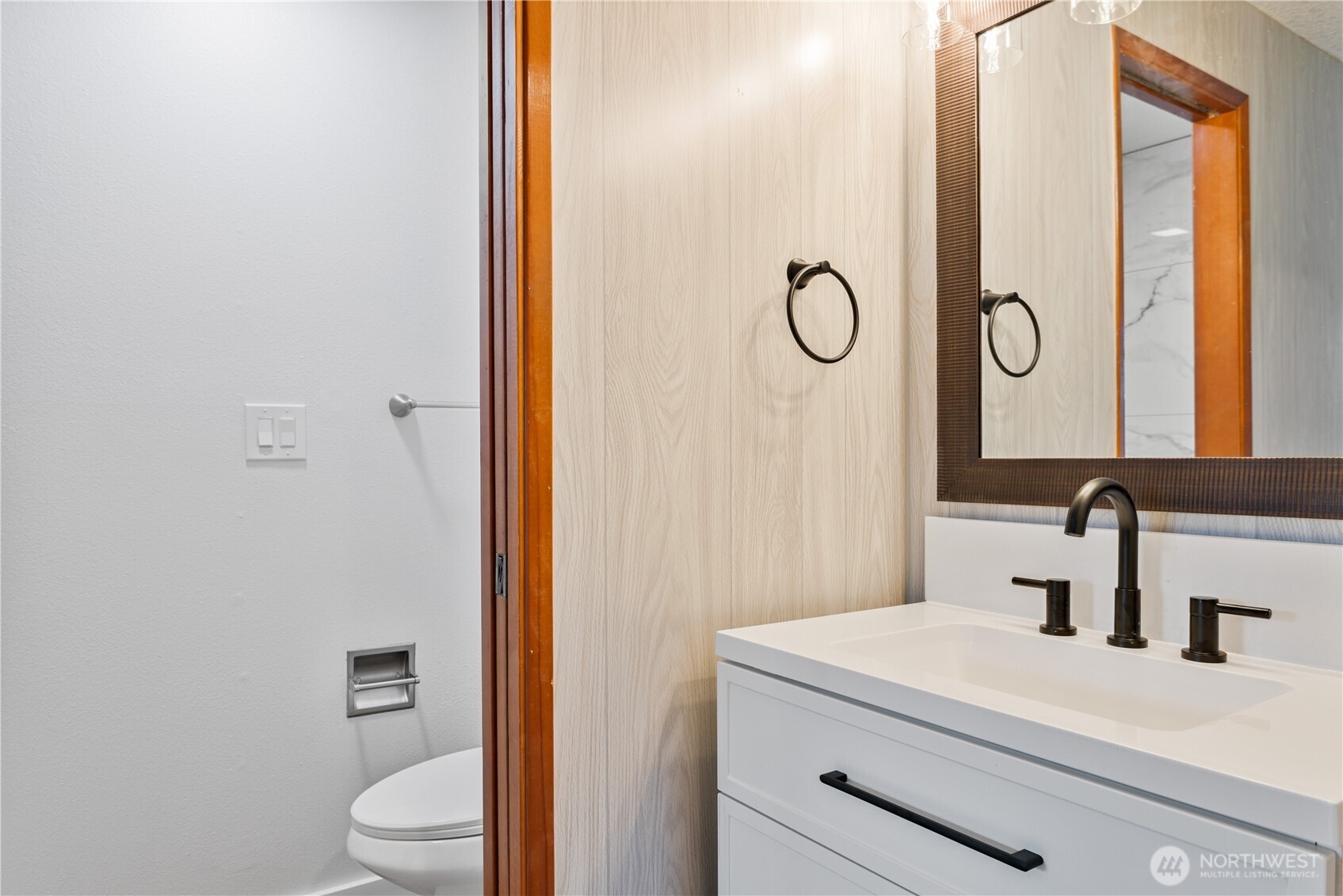 2421 Hickory Avenue Longview, WA 98632 - Photo 14 of 26 a bathroom with a granite countertop toilet a sink and a mirror