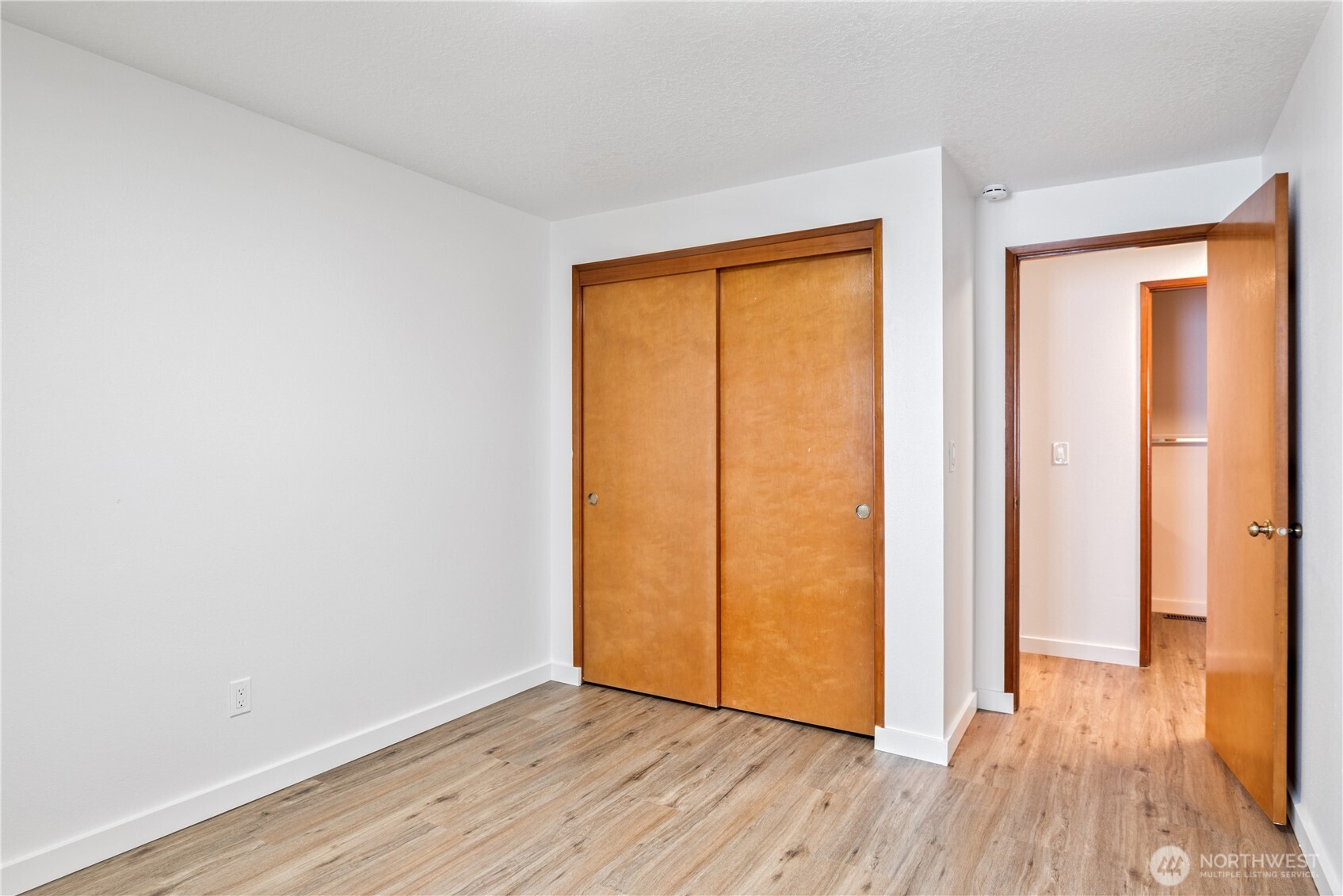 2421 Hickory Avenue Longview, WA 98632 - Photo 17 of 26 an empty room with wooden floor and a window