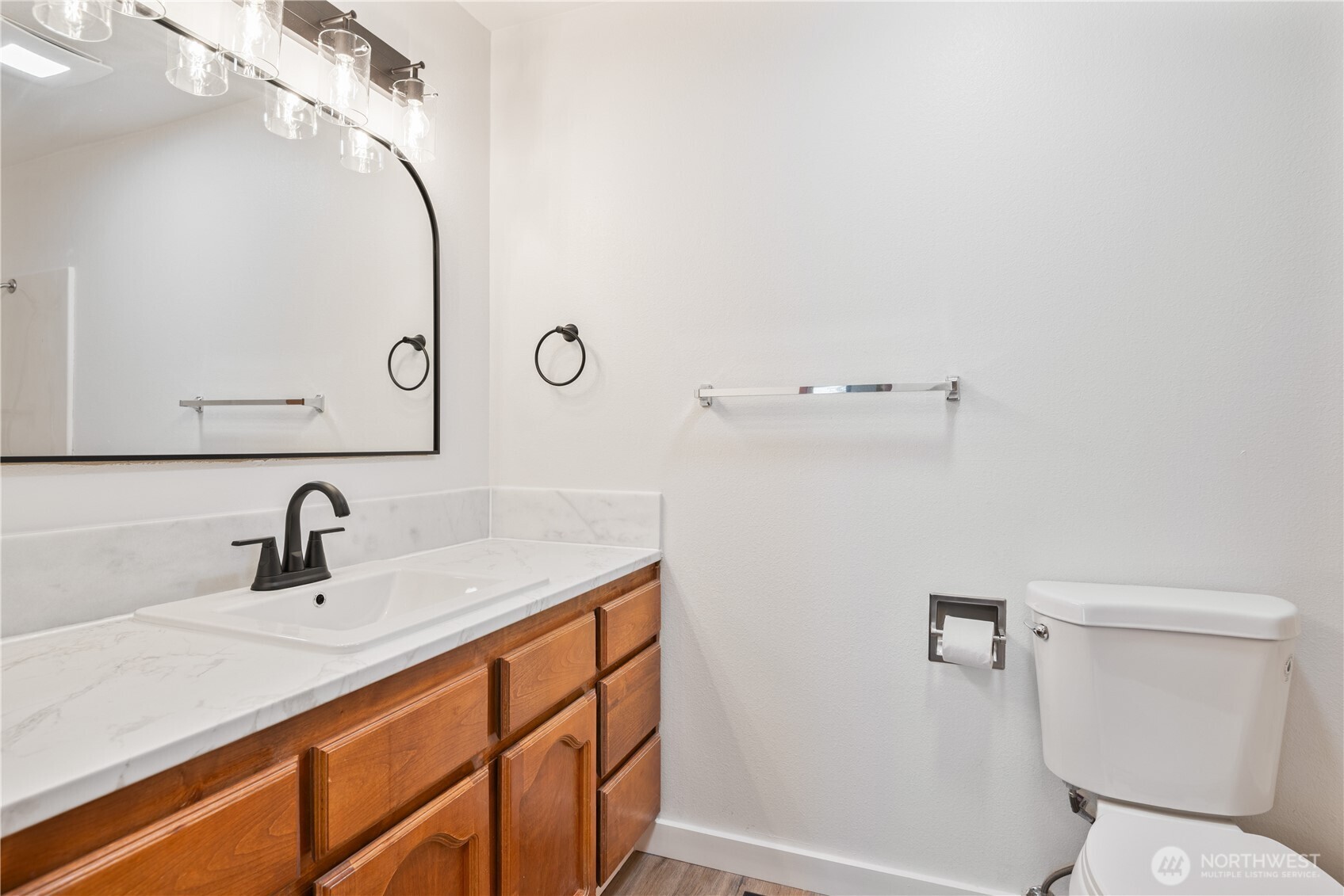 2421 Hickory Avenue Longview, WA 98632 - Photo 18 of 26 a bathroom with a sink a toilet and a mirror