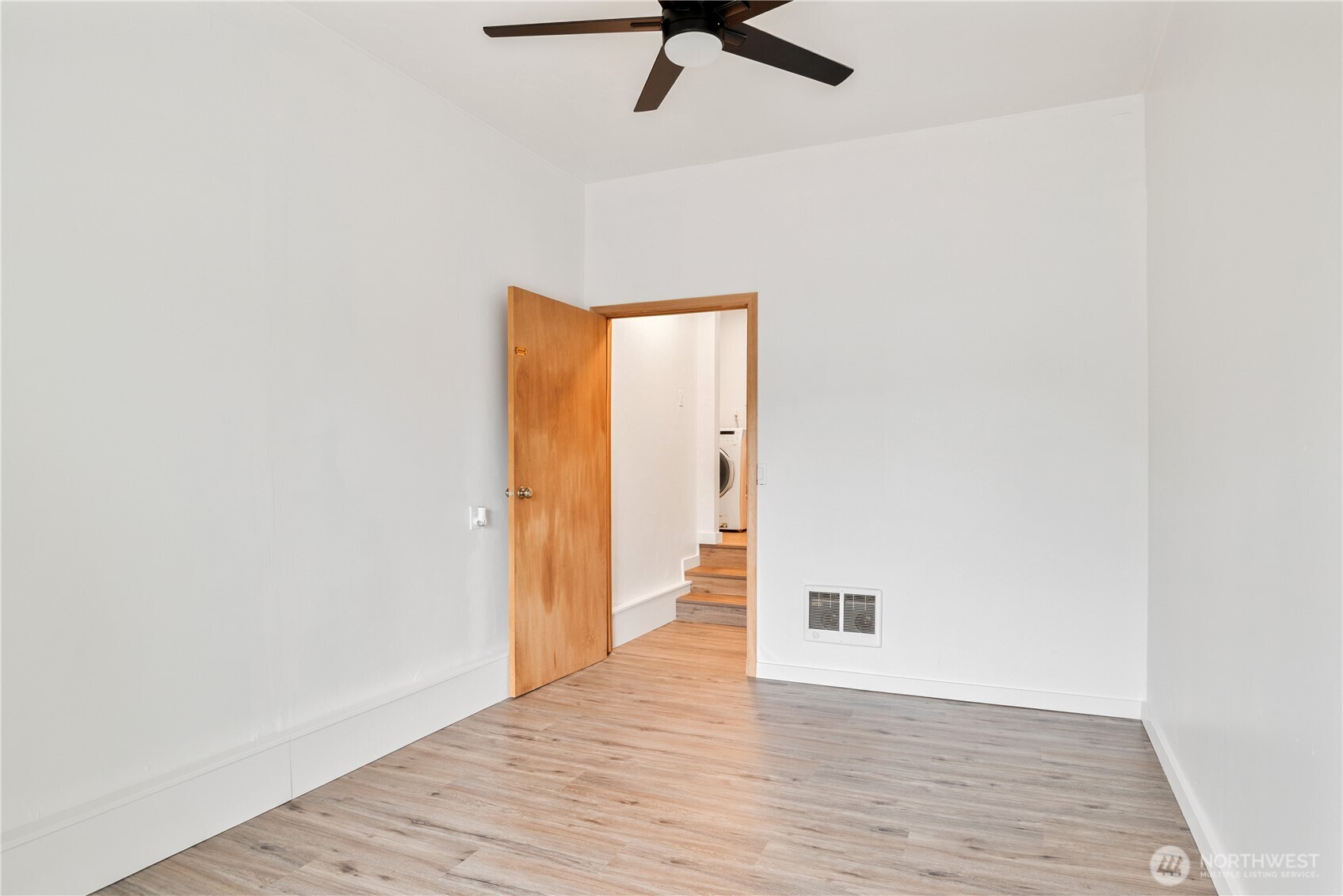 2421 Hickory Avenue Longview, WA 98632 - Photo 20 of 26 a view of an empty room with wooden floor