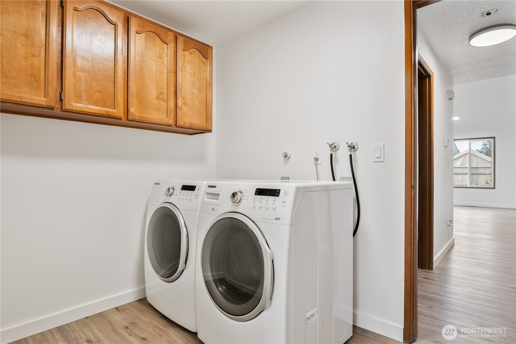 2421 Hickory Avenue Longview, WA 98632 - Photo 21 of 26 a view of a hallway with washer and dryer