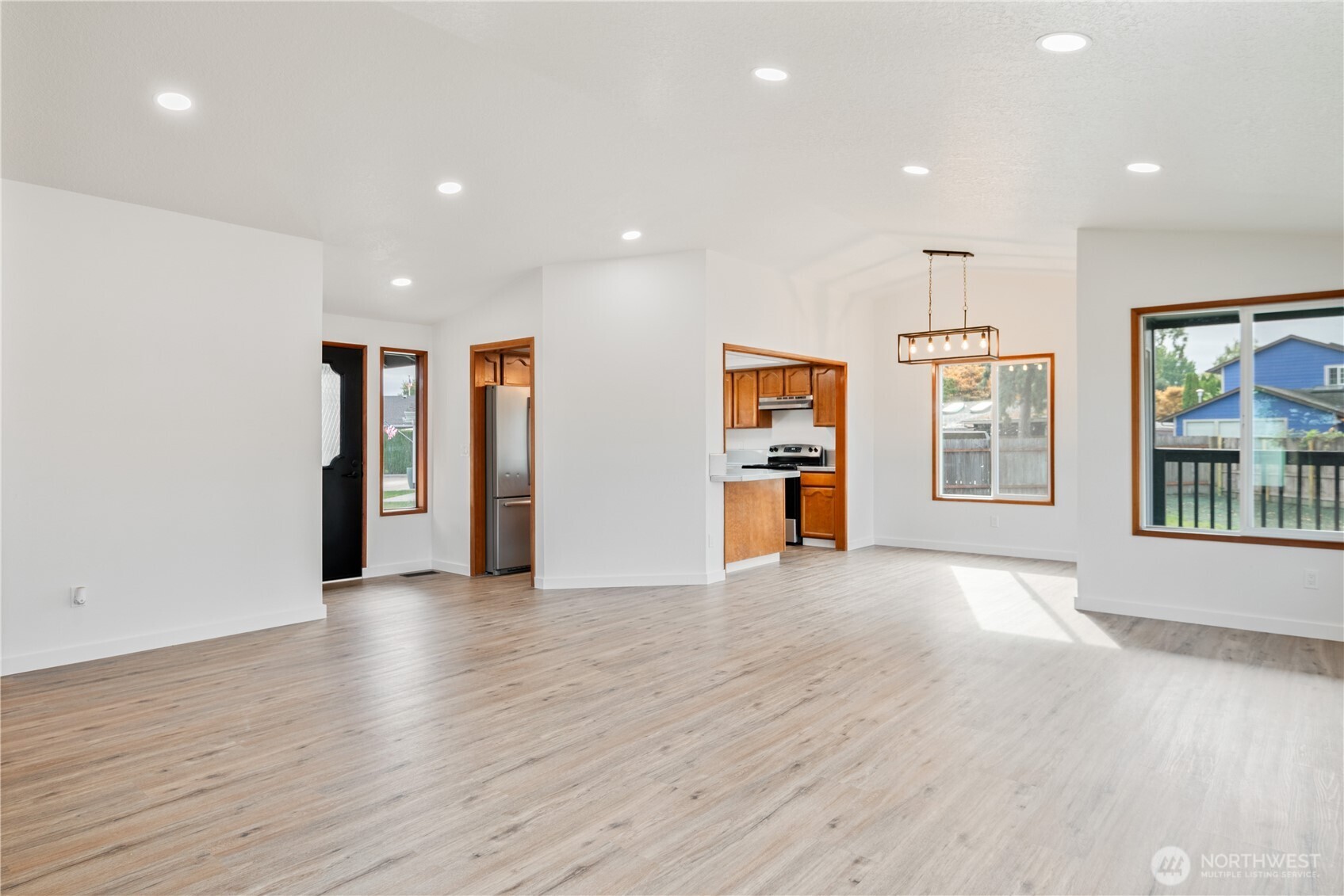 2421 Hickory Avenue Longview, WA 98632 - Photo 7 of 26 a view of an empty room with window and wooden floor