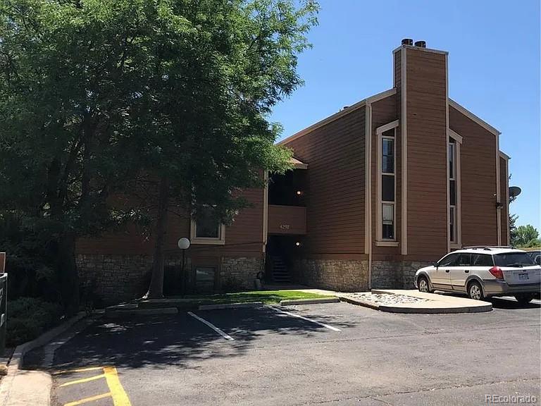 4292 South Salida Way, Unit 7 Aurora, CO 80013 - Photo 1 of 14 a view of street with parked cars