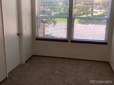 4292 South Salida Way, Unit 7 Aurora, CO 80013 - Photo 12 of 14 a view of an empty room with a window