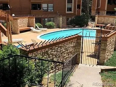 a view of a wooden deck with a yard