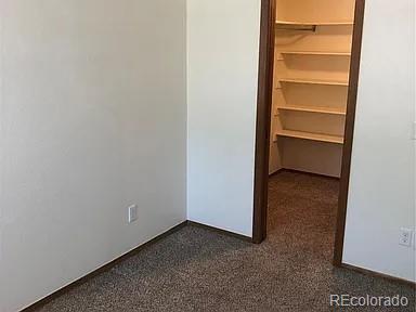 4292 South Salida Way, Unit 7 Aurora, CO 80013 - Photo 6 of 14 a view of an empty walk in closet
