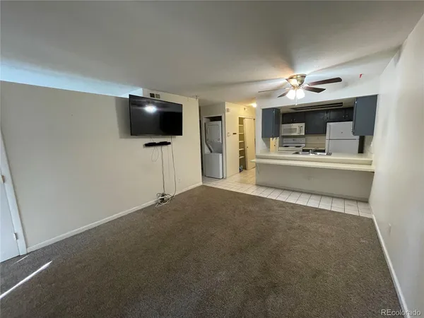 a living room with a flat screen tv and a fireplace