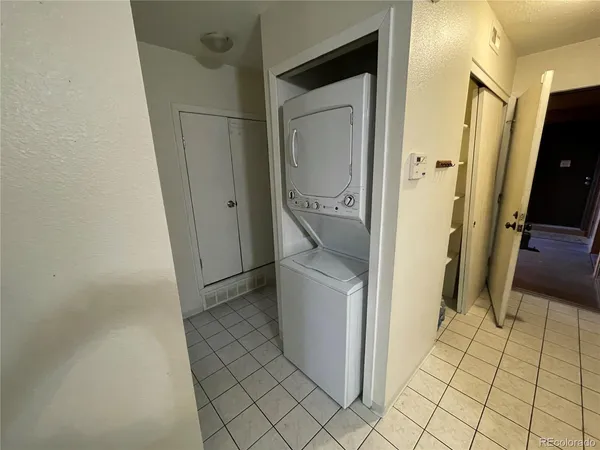 a bathroom with a granite countertop shower and a sink