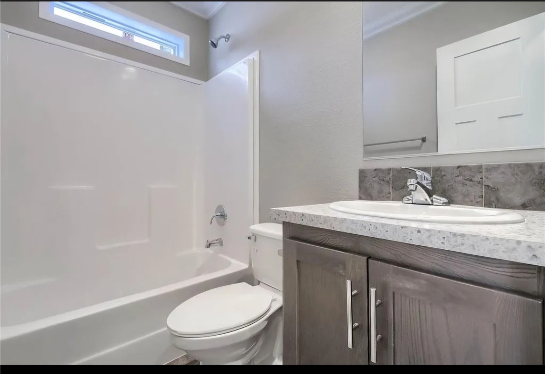847 Airport Road Breckenridge, CO 80424 - Photo 4 of 17 a bathroom with a granite countertop toilet sink and mirror