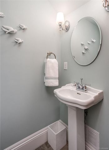 a bathroom with a sink a mirror and a toilet