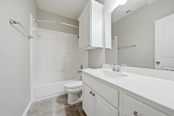 a bathroom with a sink a toilet and vanity