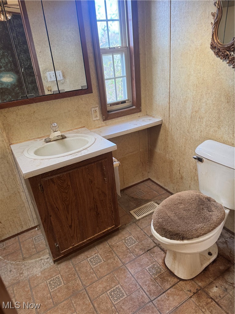11056 Leader Road Chardon, OH 44024 - Photo 12 of 17 Half bathroom featuring vanity and toilet