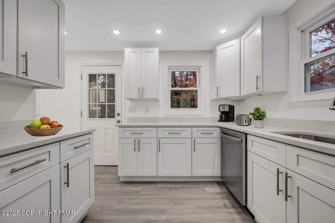 752 Toll Road Effort, PA 18330 - Photo 16 of 101 a kitchen with white cabinets and sink