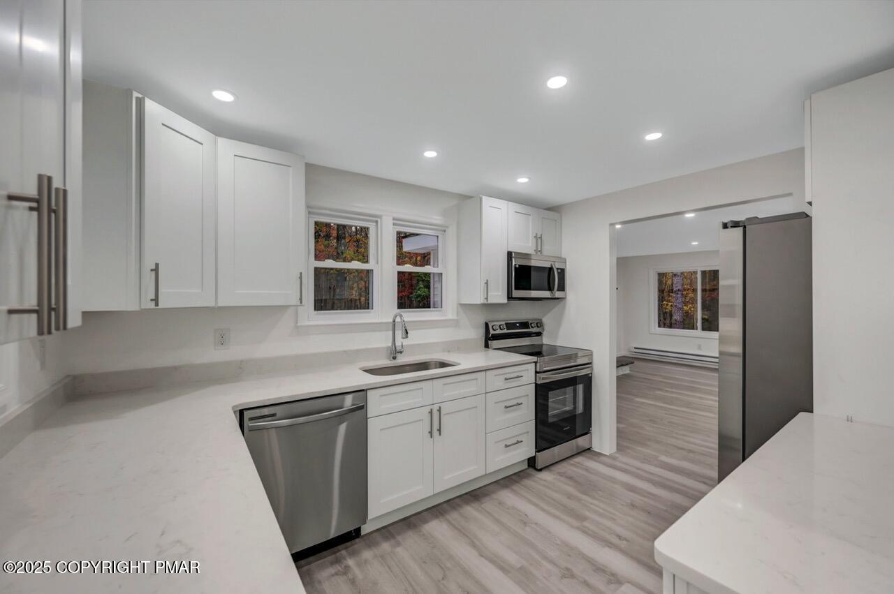 752 Toll Road Effort, PA 18330 - Photo 24 of 101 a kitchen with a sink stainless steel appliances and cabinets