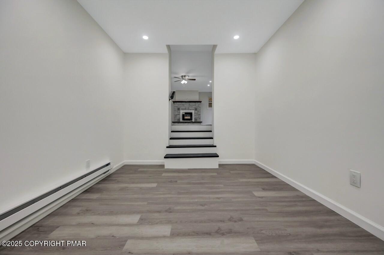 752 Toll Road Effort, PA 18330 - Photo 28 of 101 a view of a hallway with stairs and wooden floor