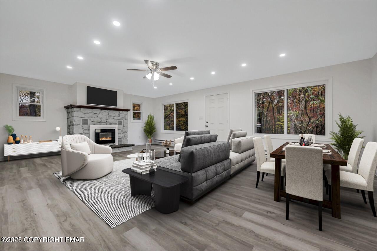 752 Toll Road Effort, PA 18330 - Photo 6 of 101 a living room with furniture a fireplace and a flat screen tv