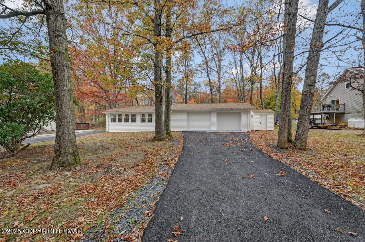 752 Toll Road Effort, PA 18330 - Photo 87 of 101 a front view of a house with a yard and tree