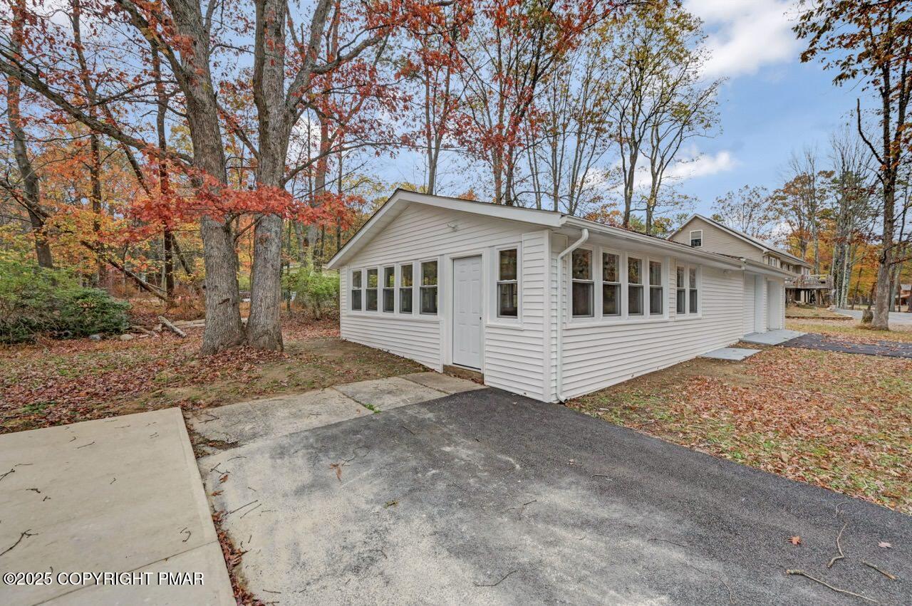 752 Toll Road Effort, PA 18330 - Photo 90 of 101 a front view of a house with a yard and trees