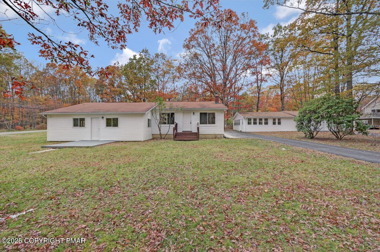 752 Toll Road Effort, PA 18330 - Photo 92 of 101 a front view of a house with garden