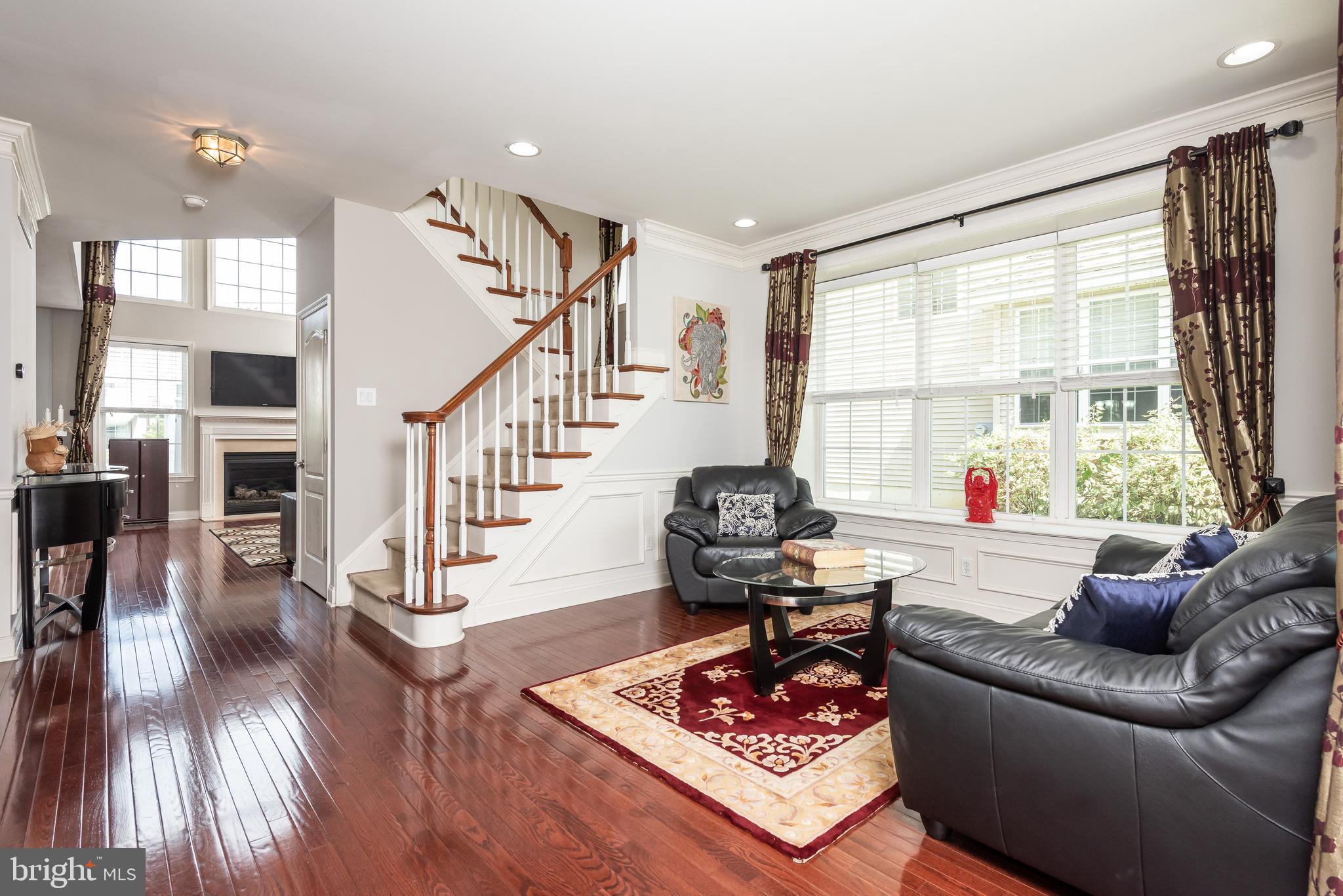 2604 Rockledge Court Chester Springs, PA 19425 - Photo 11 of 44 a living room with furniture and a large window or wooden floor