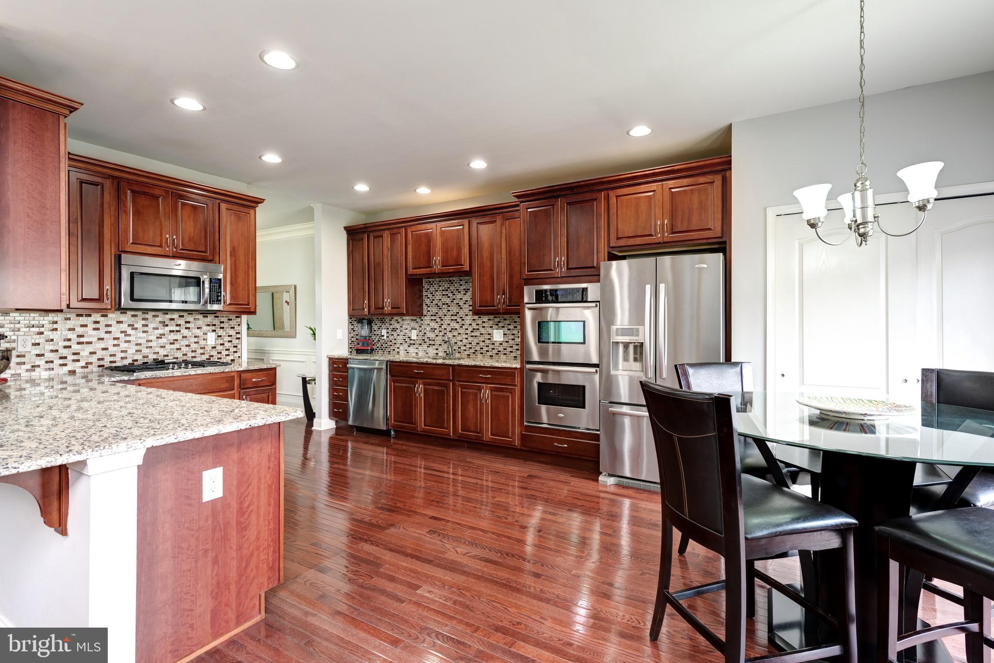 2604 Rockledge Court Chester Springs, PA 19425 - Photo 21 of 44 a large kitchen with a table and chairs