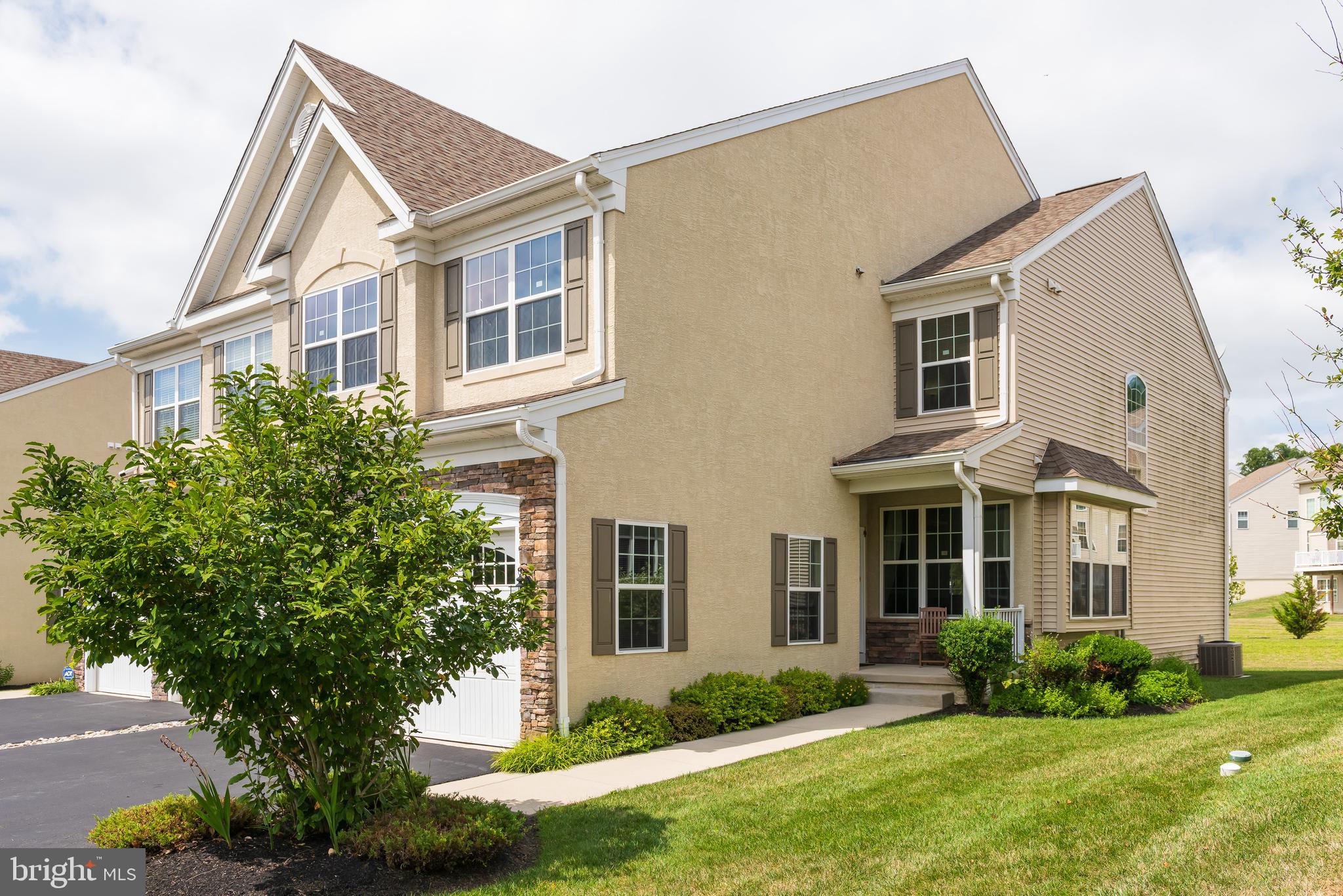 2604 Rockledge Court Chester Springs, PA 19425 - Photo 3 of 44 a front view of a house with a yard and trees
