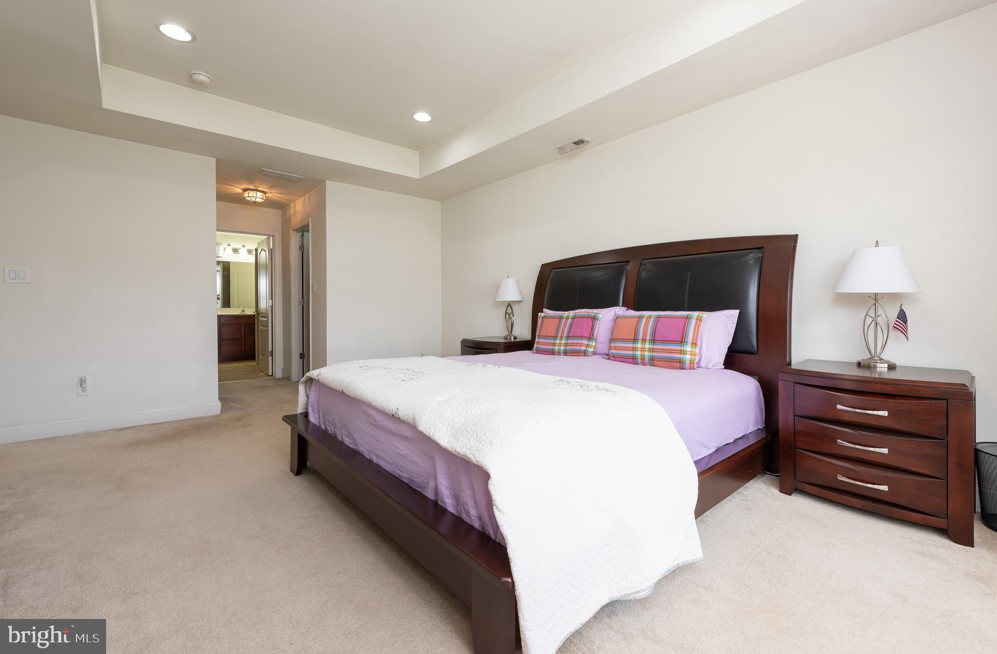 2604 Rockledge Court Chester Springs, PA 19425 - Photo 38 of 44 a bedroom with a bed and a lamp