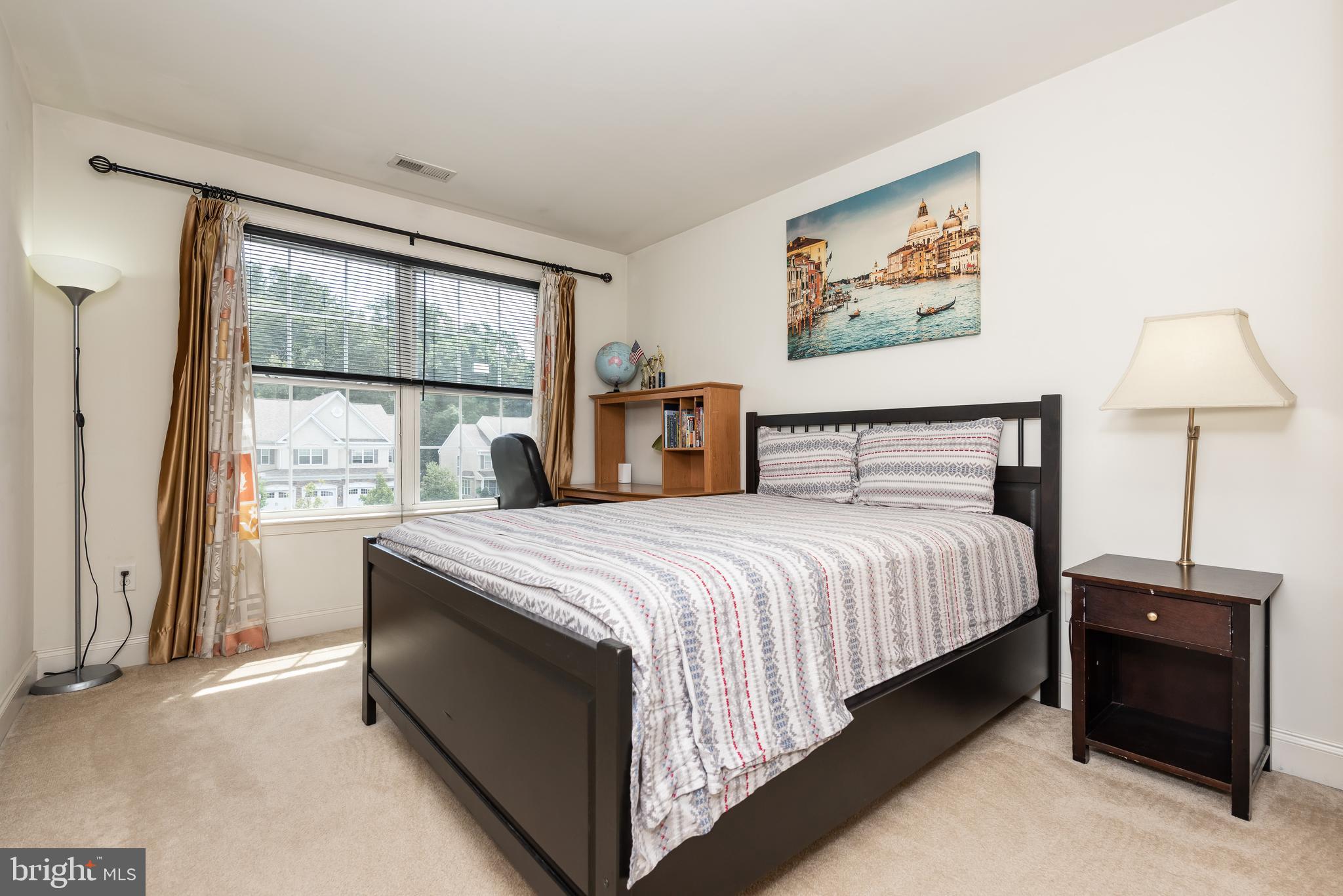 2604 Rockledge Court Chester Springs, PA 19425 - Photo 43 of 44 a bedroom with a bed and a window