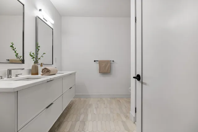 a bathroom with a sink and mirror
