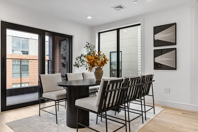 a dining room with furniture and window