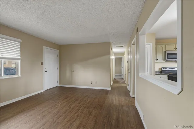 a view of a kitchen cabinets and wooden floor