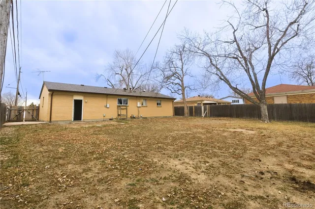 a view of house with yard