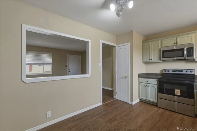 a kitchen with a stove and a microwave