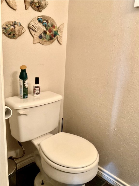6718 Silvermine Drive, Unit 702 Austin, TX 78736 - Photo 11 of 19 a white toilet sitting next to a white sink
