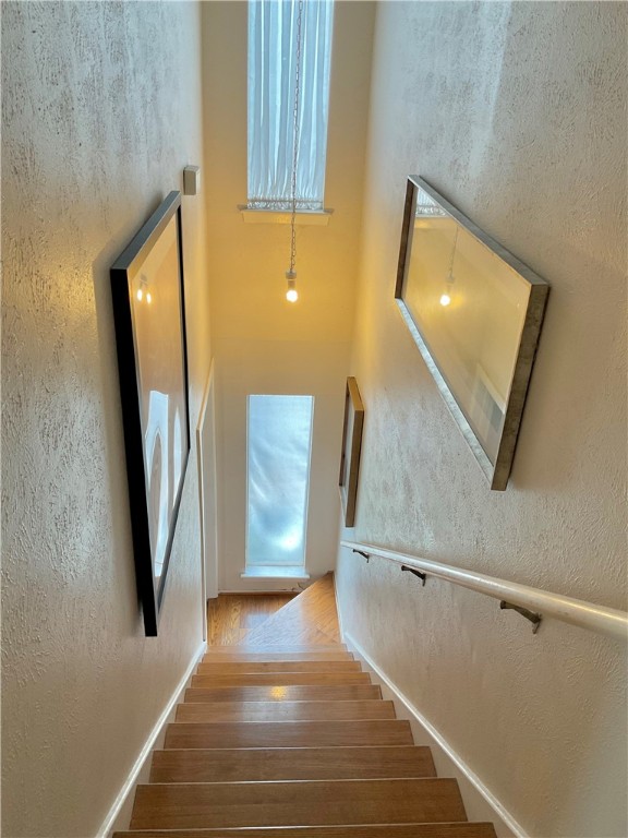 6718 Silvermine Drive, Unit 702 Austin, TX 78736 - Photo 12 of 19 a view of a hallway with wooden floor and entryway