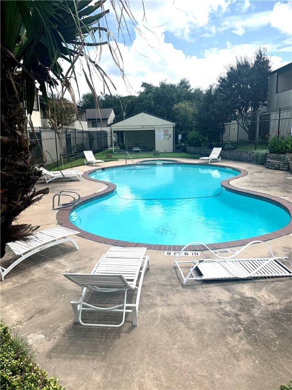 6718 Silvermine Drive, Unit 702 Austin, TX 78736 - Photo 19 of 19 a swimming pool with outdoor seating and yard