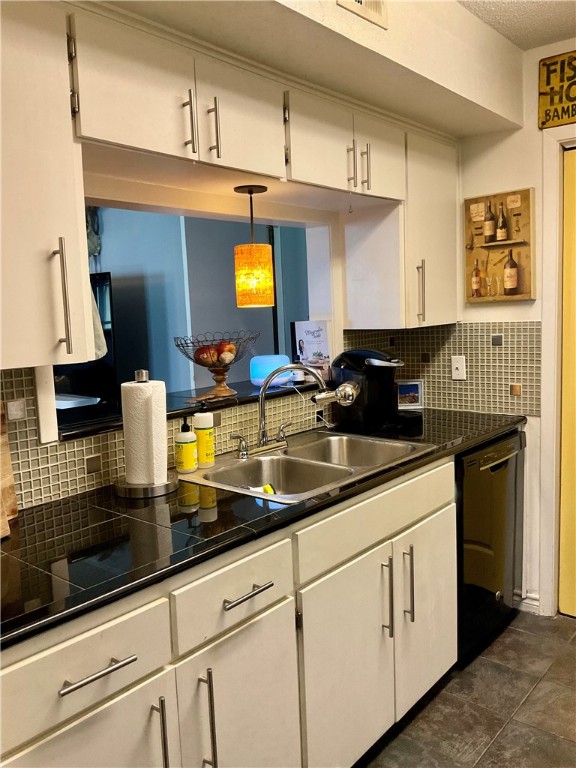 6718 Silvermine Drive, Unit 702 Austin, TX 78736 - Photo 6 of 19 a kitchen with stainless steel appliances granite countertop a sink a stove and cabinets