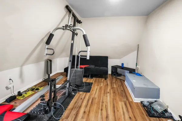 a view of a living room with wooden floor