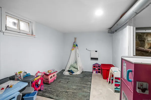a bedroom with furniture and a gym equipment