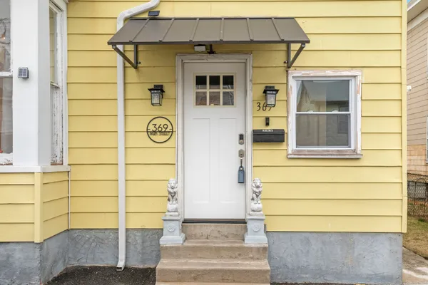 a front view of a house with a shower