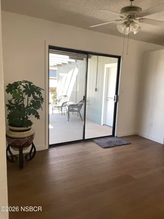 a view of a kitchen with a sink cabinet and a window
