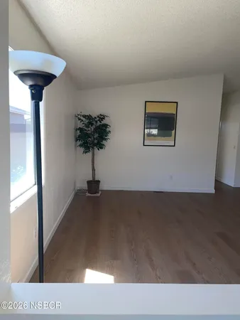 a view of a hallway with a potted plant