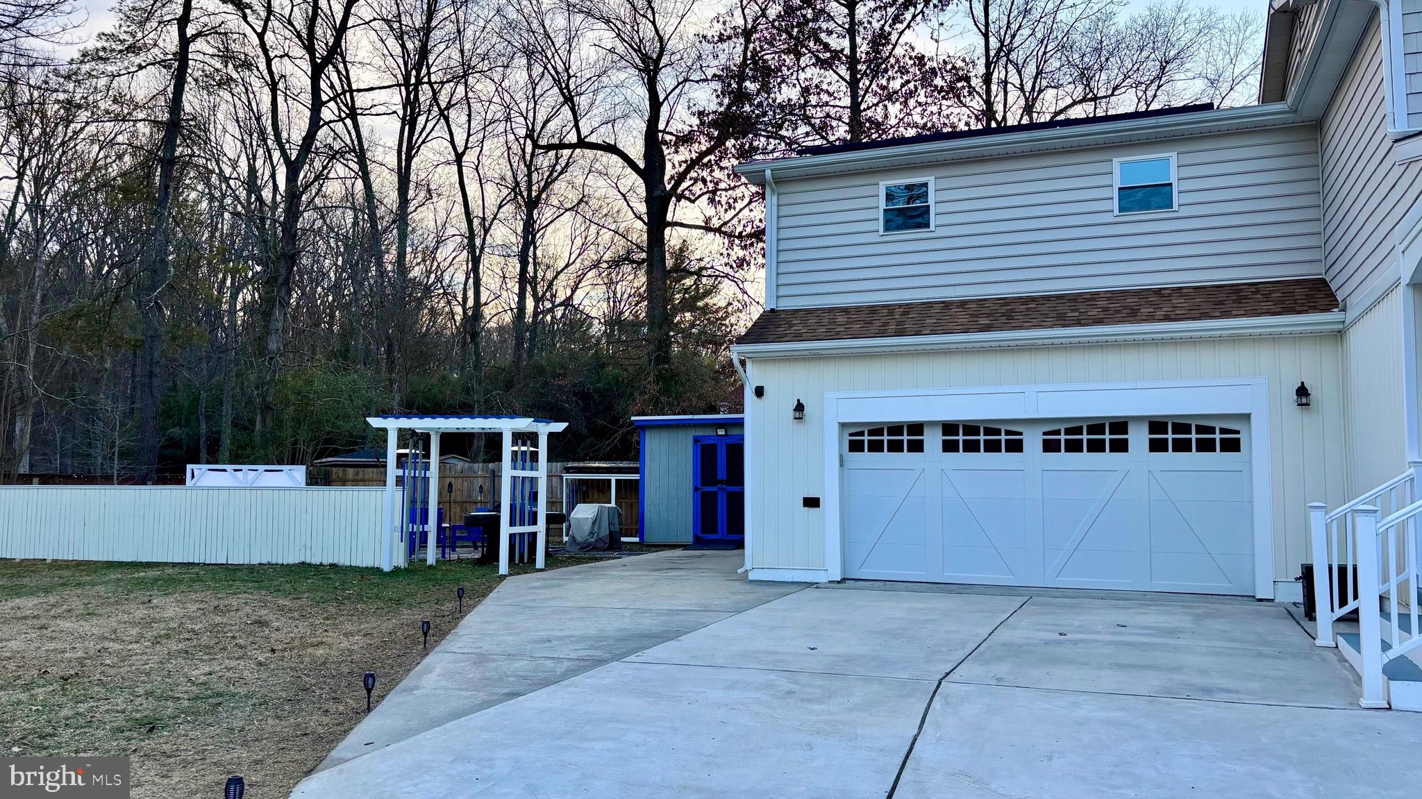 142 Farmington Road West Accokeek, MD 20607 - Photo 22 of 112 a view of a house with a backyard and a tree