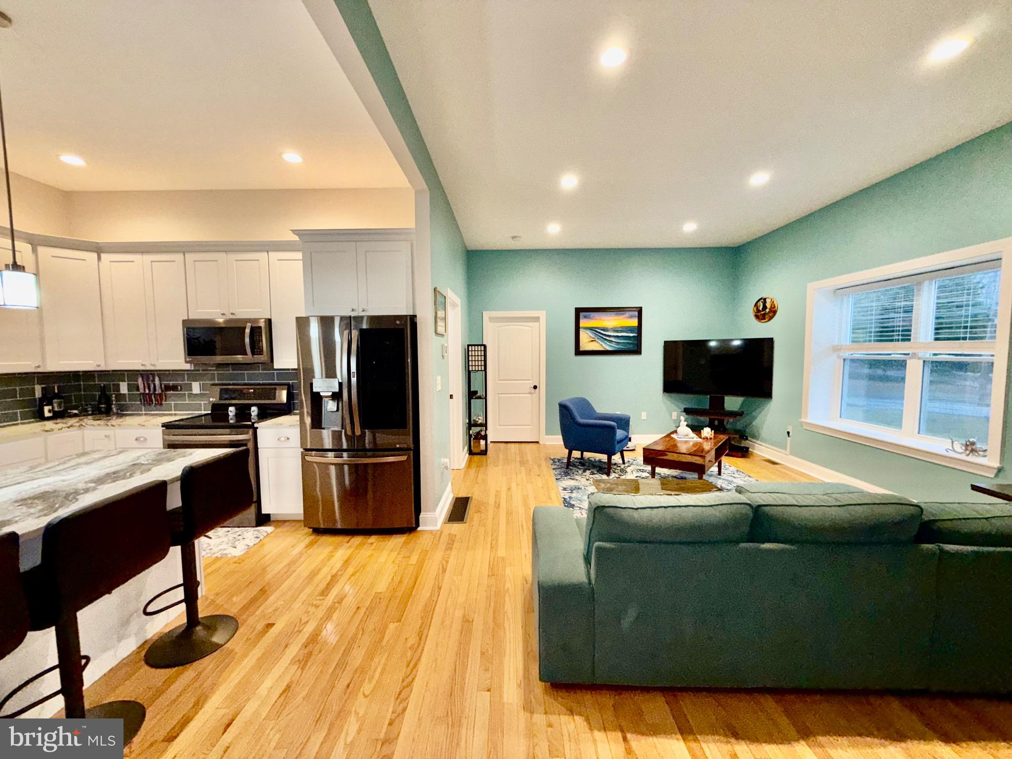 142 Farmington Road West Accokeek, MD 20607 - Photo 51 of 112 a living room with stainless steel appliances furniture and a flat screen tv