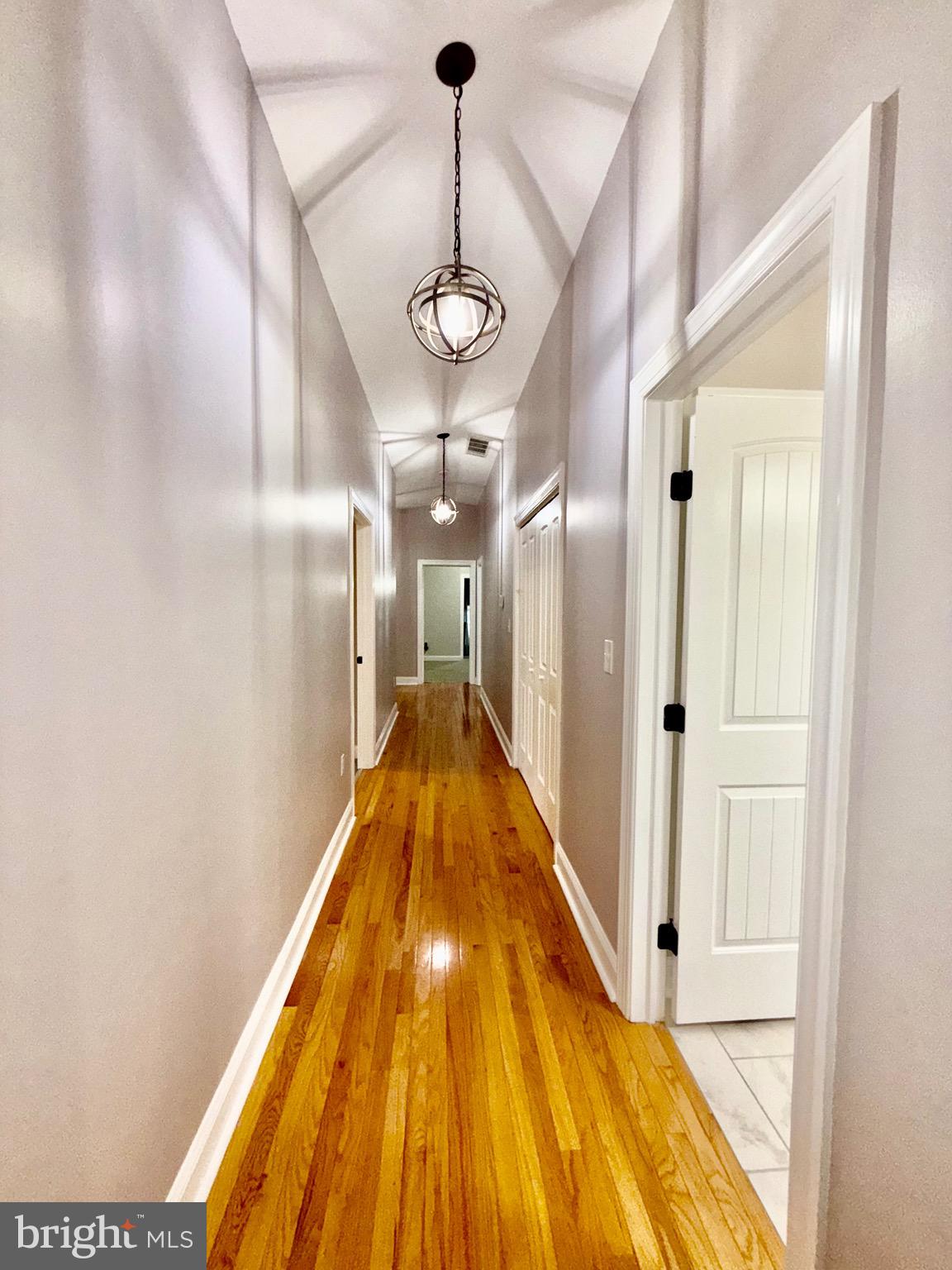 142 Farmington Road West Accokeek, MD 20607 - Photo 60 of 112 a view of a hallway with wooden floor
