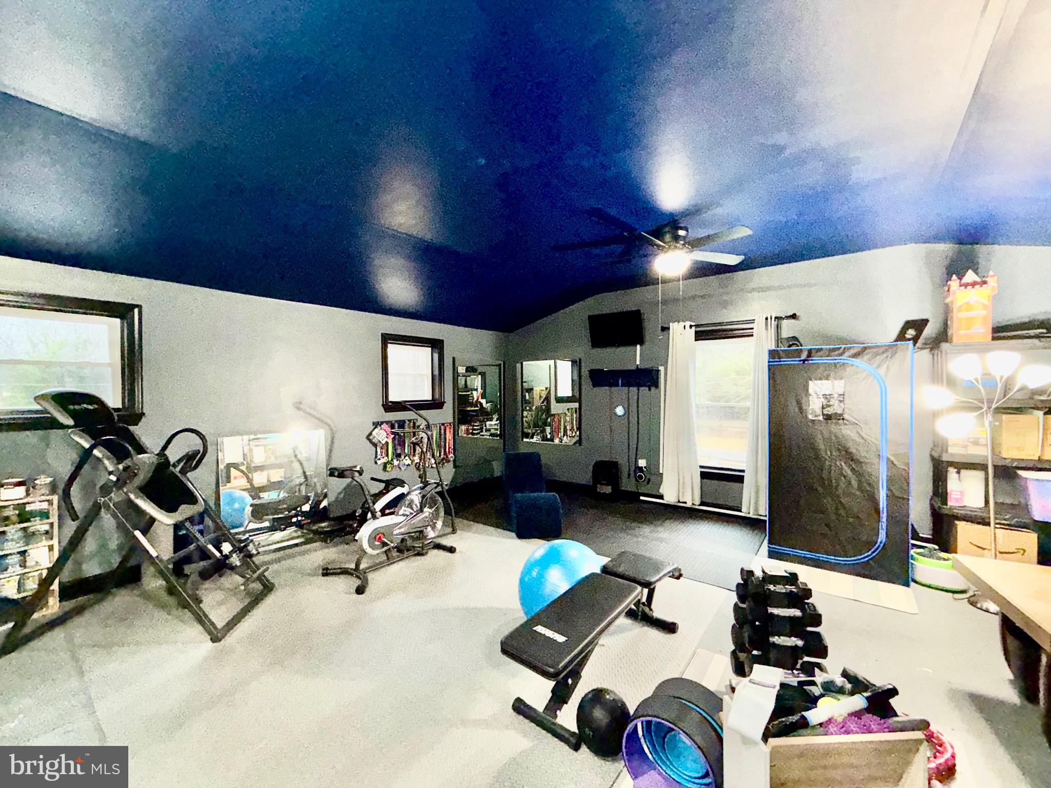 142 Farmington Road West Accokeek, MD 20607 - Photo 81 of 112 a room with gym equipment and a large window